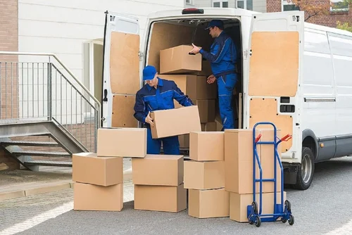Professional Dubai movers dismantling and transporting furniture