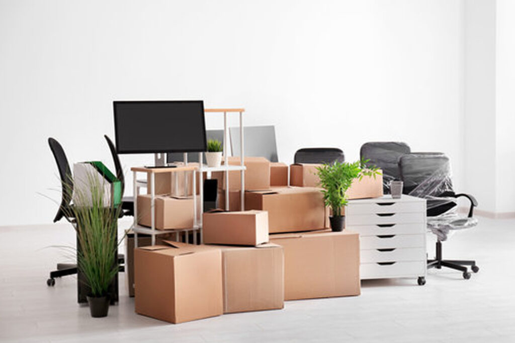 Trained movers labeling office equipment in Abu Dhabi